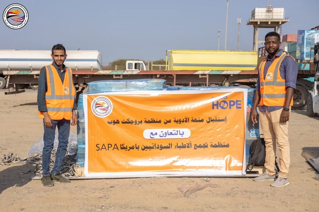 two men holding banner